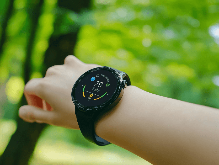 A sleek Samsung Galaxy Watch displayed on a table with a modern background