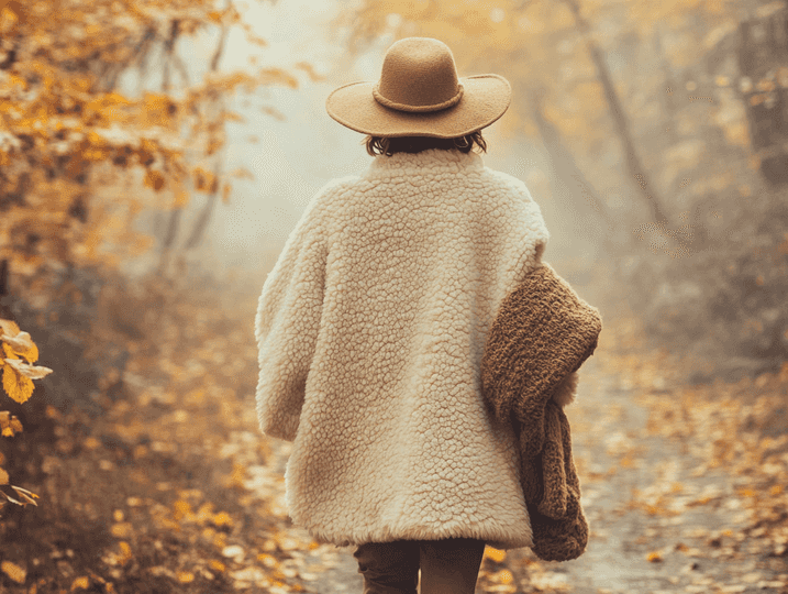 A fall outfit featuring a wide-brim hat and an oversized scarf