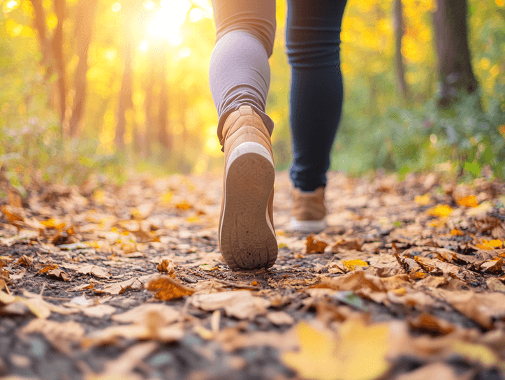 A person taking a mindful break outdoors, enjoying nature and fresh air