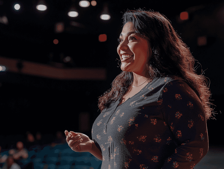 A candid moment of Gina Brillon backstage, preparing for a performance with a thoughtful expression