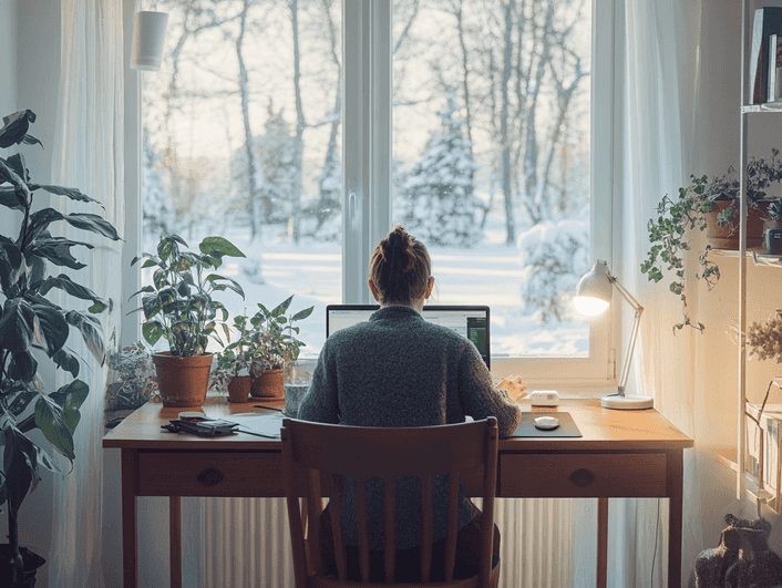 A modern light therapy lamp glowing brightly on a bedside table